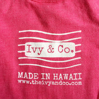 pink baby girl onesie with white Ivy & Co postage stamp logo
